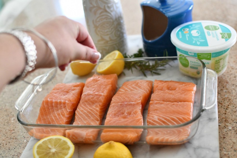 sprinkling salt on salmon before cooking 