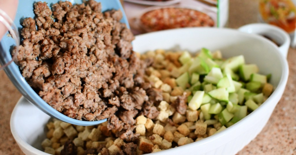 adding sausage to stuffing