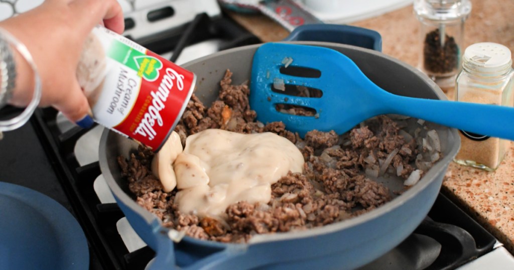 pouring a can of soup in casserole