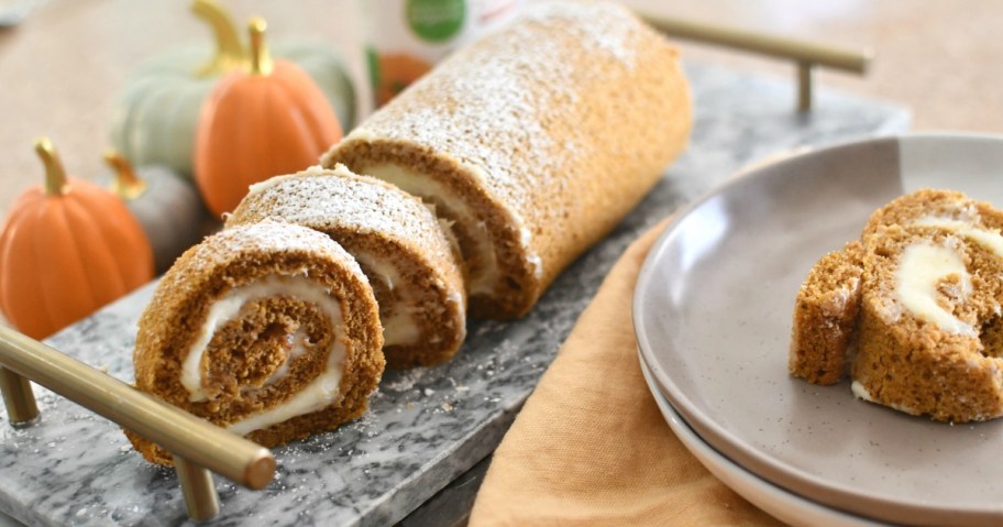 a holiday log style cake sliced on a tray