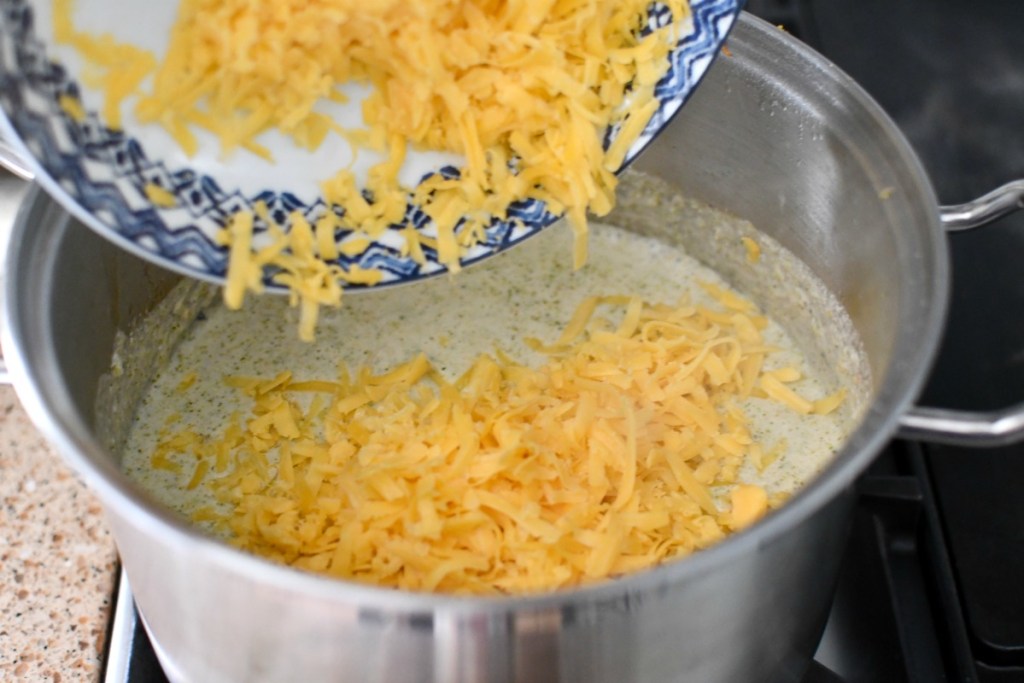 adding cheese to broccoli 