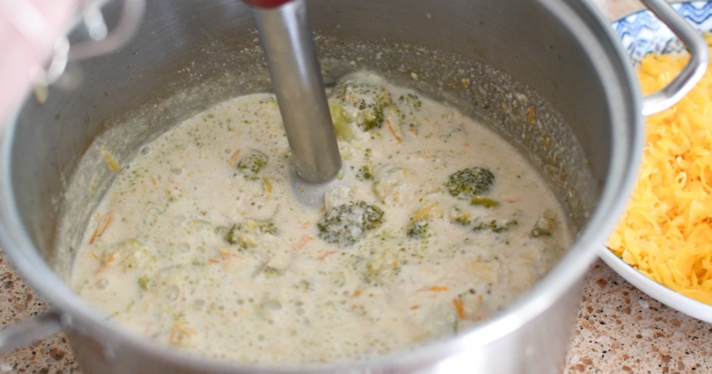 using a stick blender to blend soup