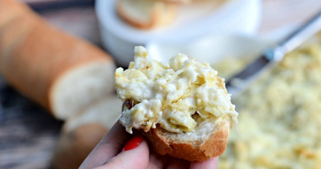 bite of artichoke cheese dip 