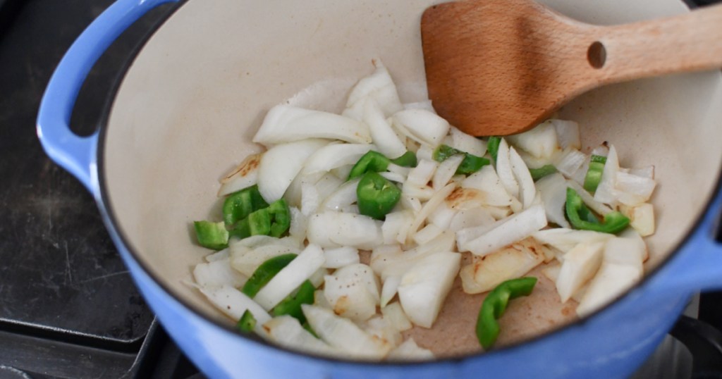 cooking onion in a pot for soup