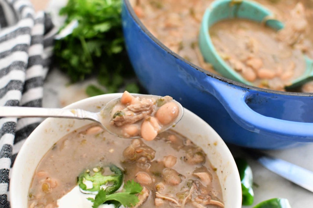 dishing up bowl of white chicken chili