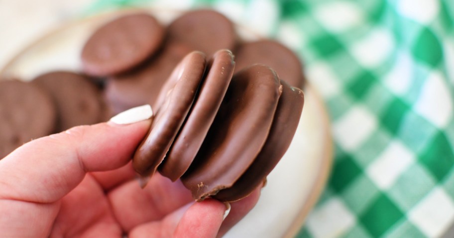 holding a stack of homemade thin mints