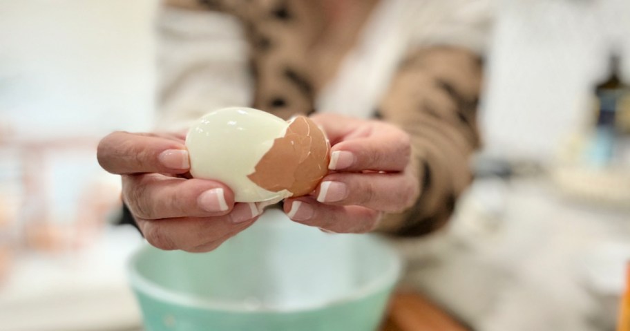 woman in the kitchen peeling eggs