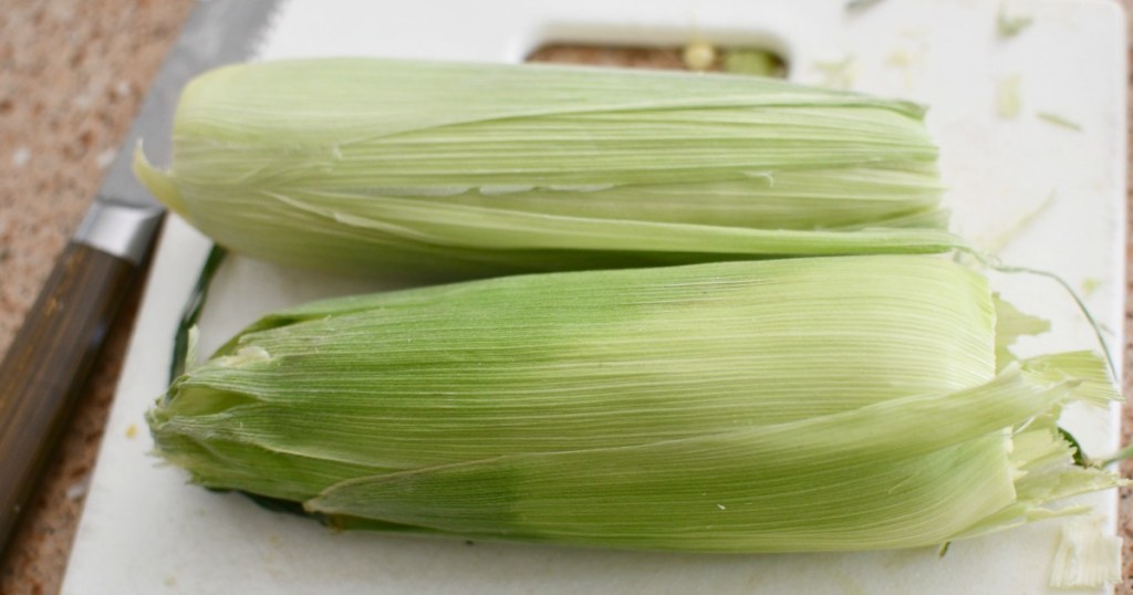 corn with bottom and top husk cut off