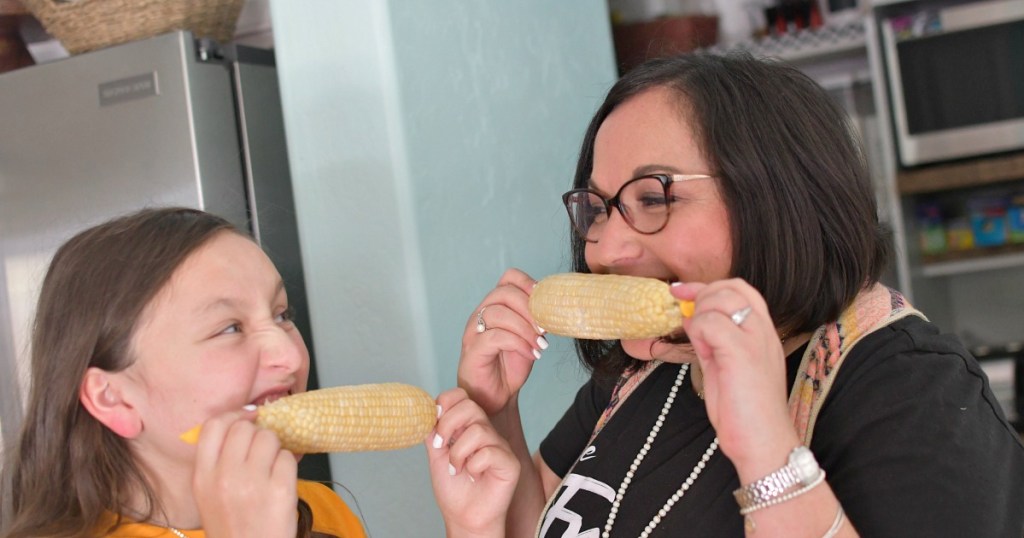 eating corn in the kitchen