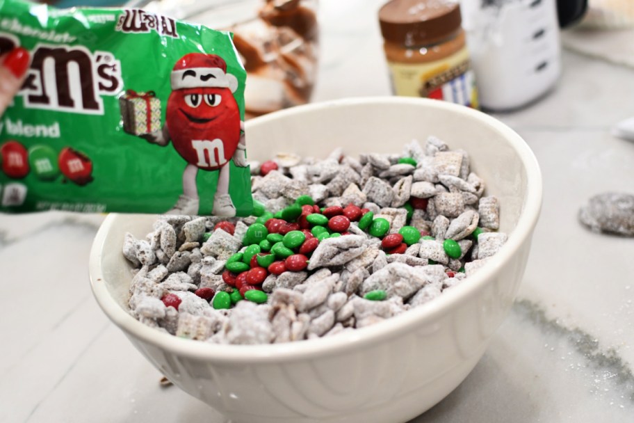 adding red and green m&ms to muddy buddies