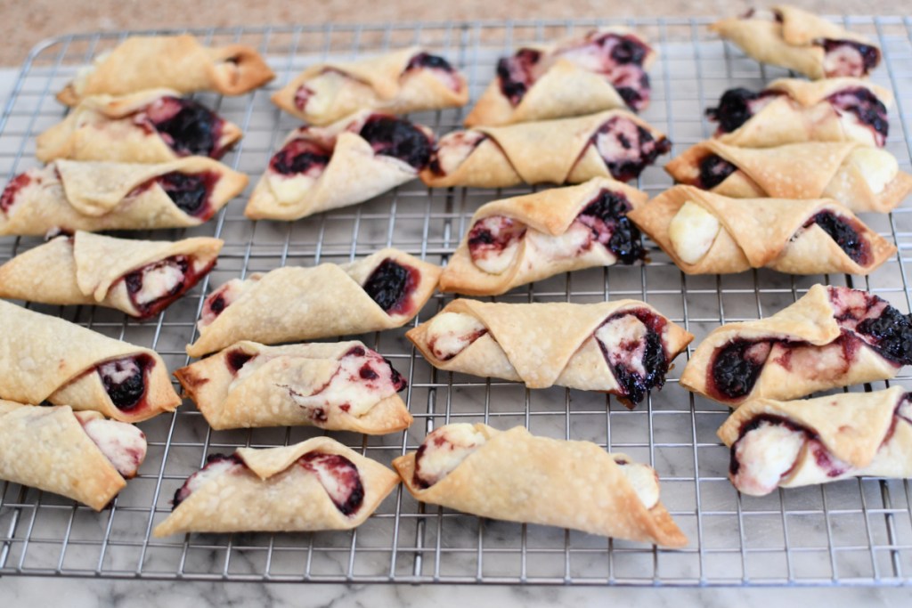 cooling rack with blackberry tarts