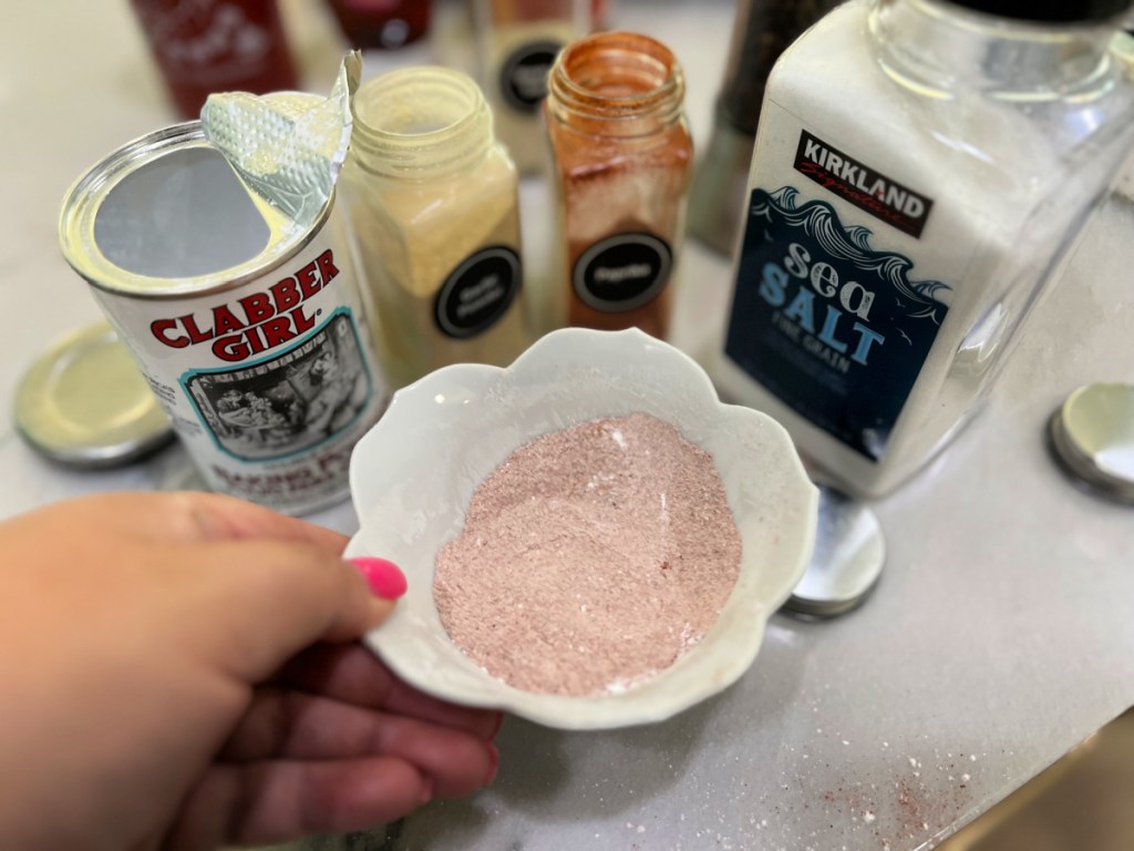 mixing a chicken wing rub in a small bowl