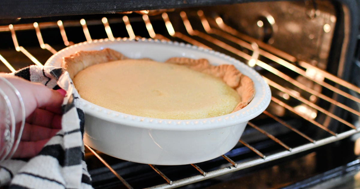 Taking a pie out of the oven. 