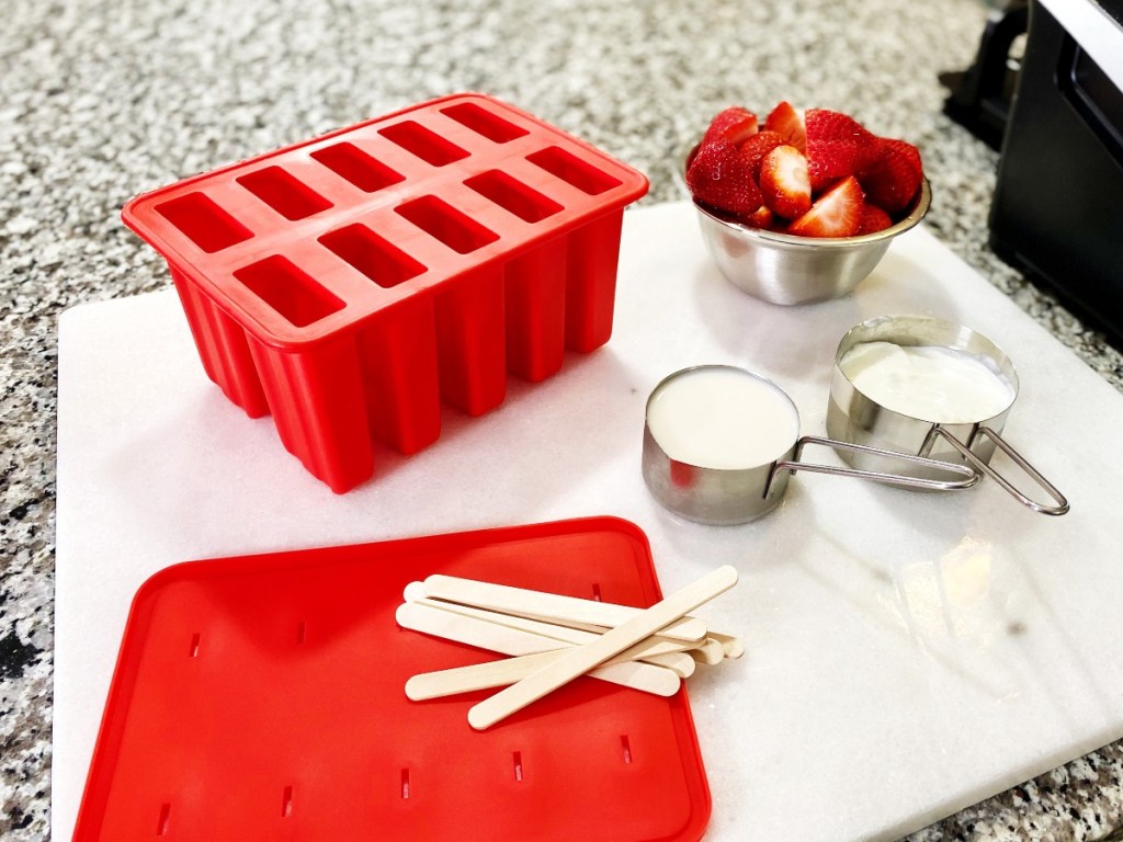 strawberry popsicle ingredients on counter