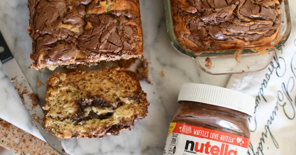 sliced banana bread with nutella on cutting board