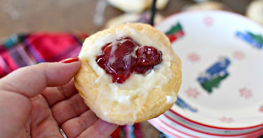 holding up a cherry cheese danish