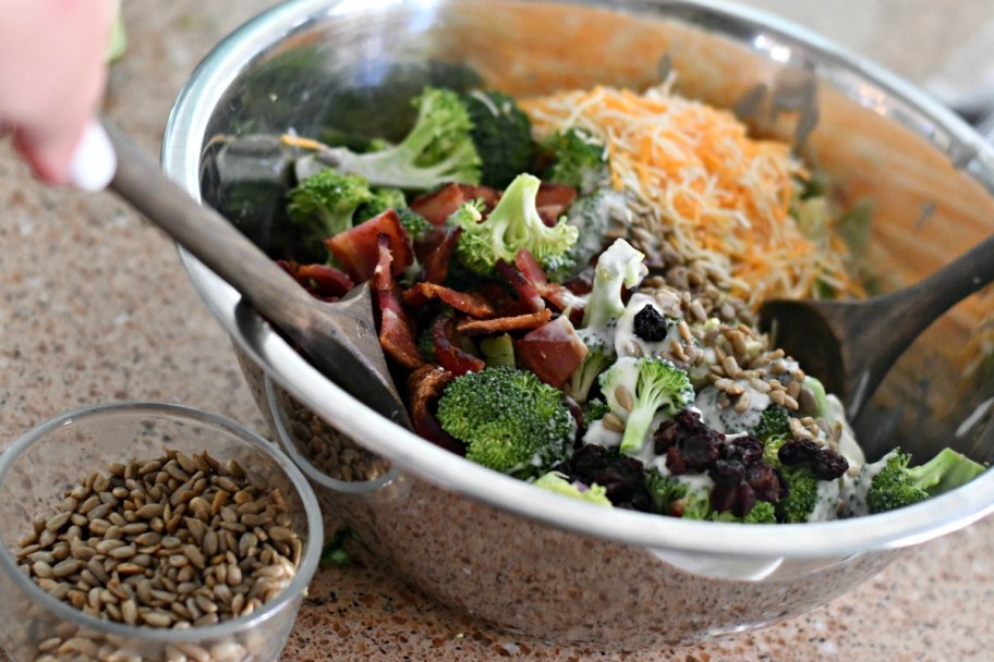 making broccoli salad in a mixing bowl 