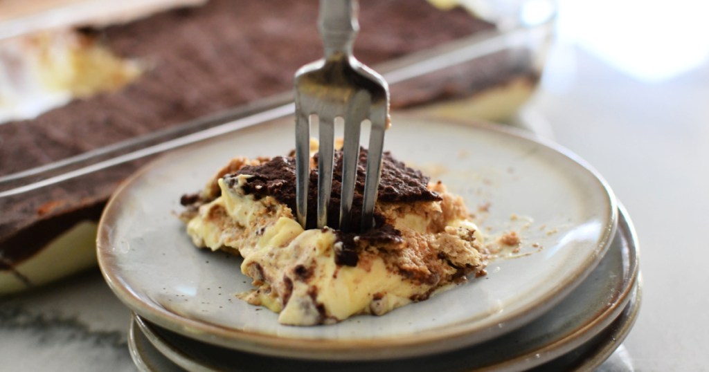 eating eclair cake with a fork