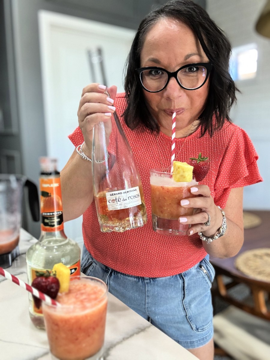 woman drinking a frozen wine smoothie