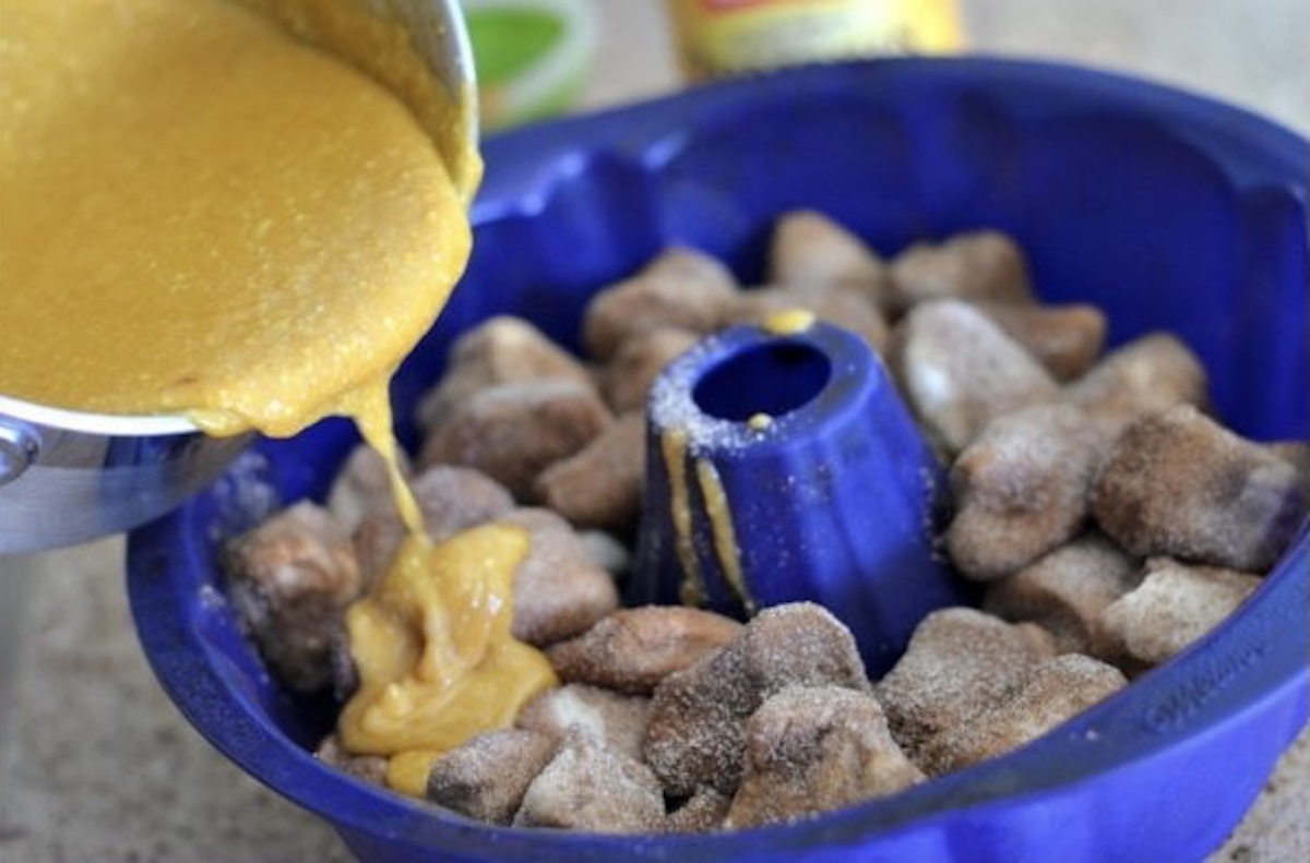 pouring pumpkin mixture on dough