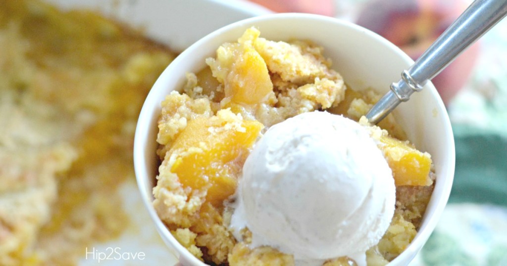 peach cobbler dump cake in bowl with ice cream 