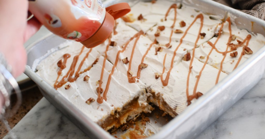 adding caramel to pumpkin dessert