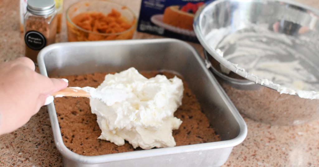 adding cream cheese layer to pumpkin delight