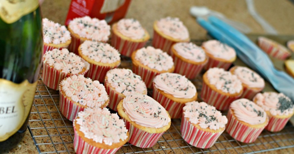 24 champagne cupcakes on the counter