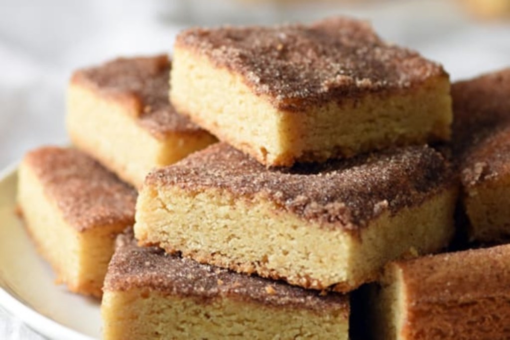 snickerdoodle bars stacked on plate