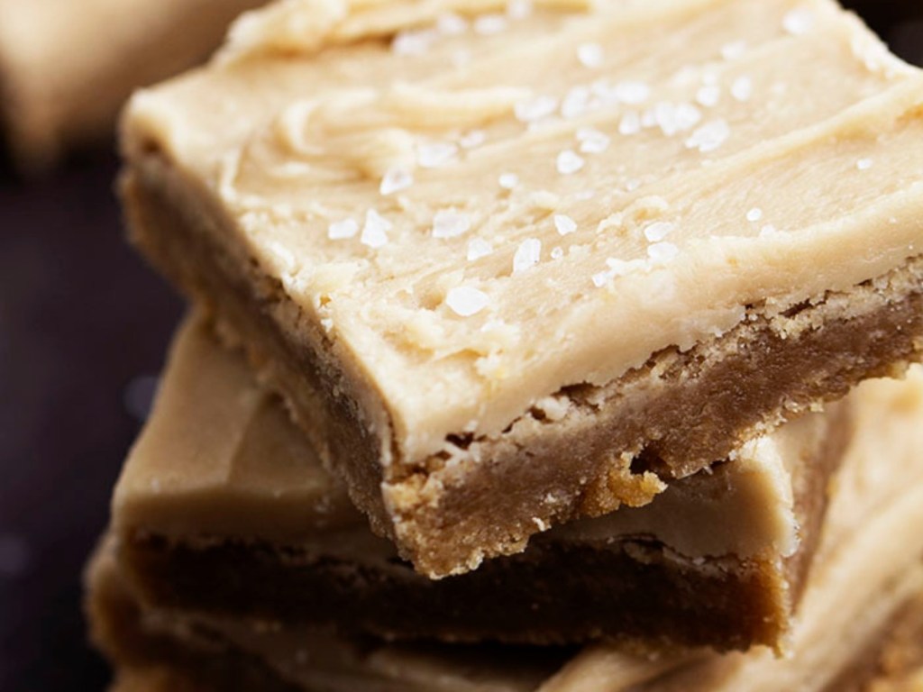 frosted brown cookie bars in stack 