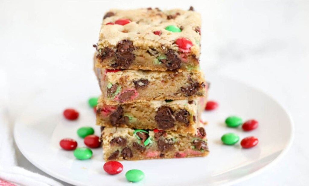 M&Ms cookie bars stacked on a white plate