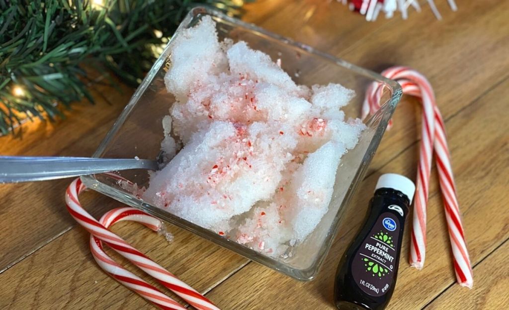 A bowl of peppermint ice cream made with snow and candy canes