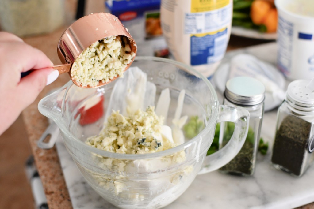 adding blue cheese to dip