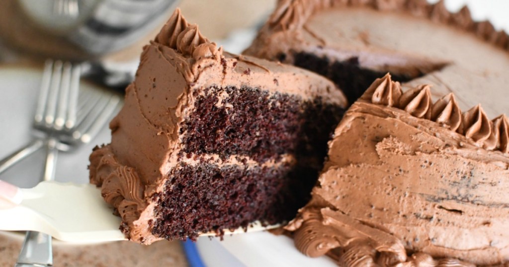 taking slice of chocolate cake