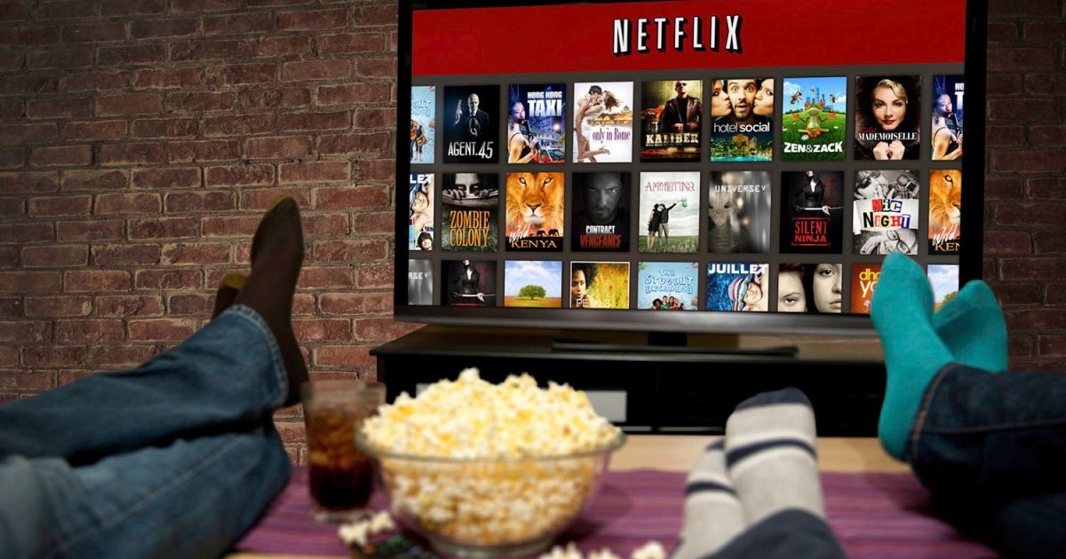 people watching netflix while eating popcorn