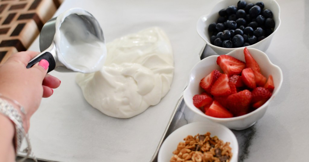 pouring yogurt on sheet pan