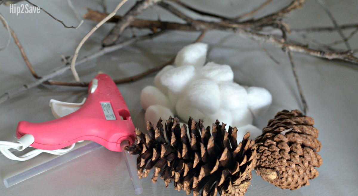 cotton stems, glue gun, and pinecones