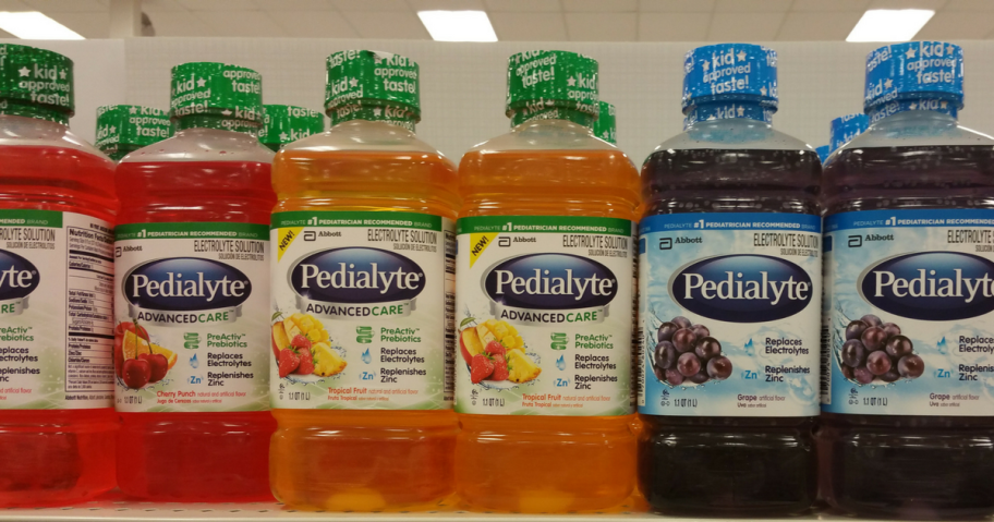 bottles of Pedialyte on a store shelf in a variety of flavors