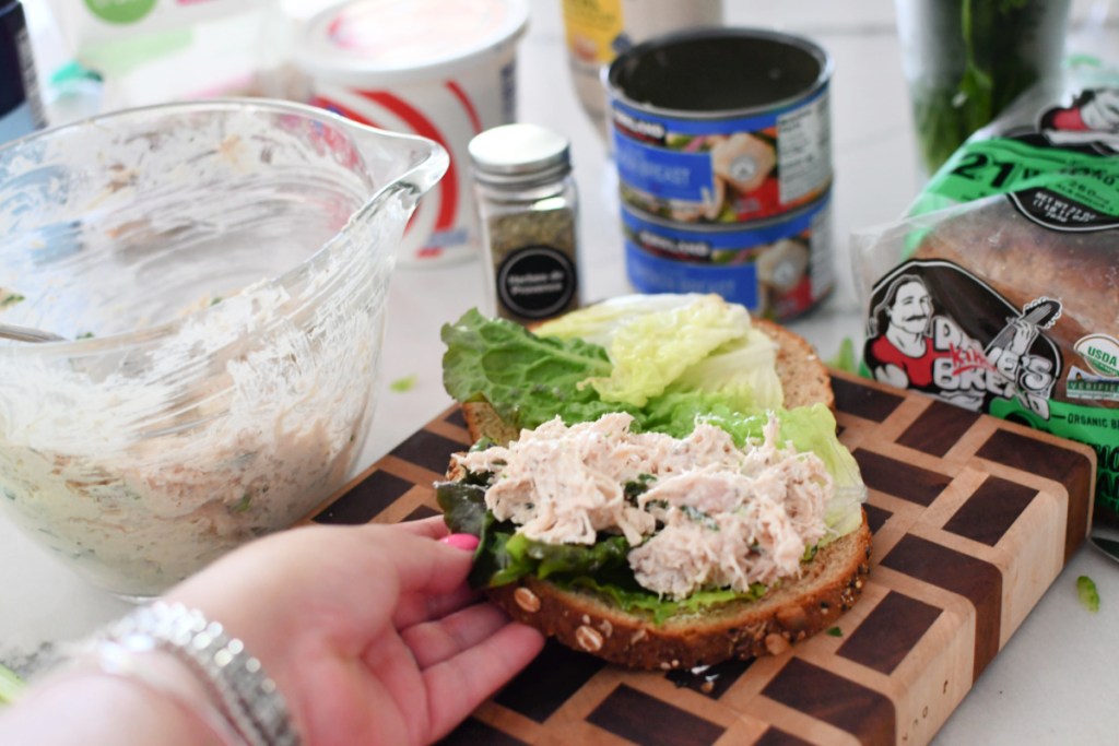 making a walnut canned chicken salad sandwich