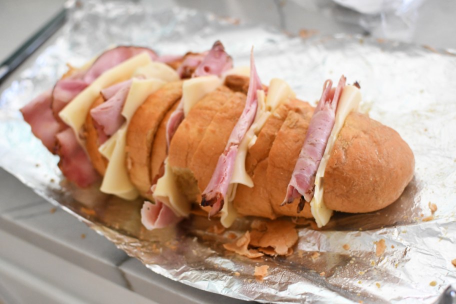 ham and cheese sandwich on foil before grilling