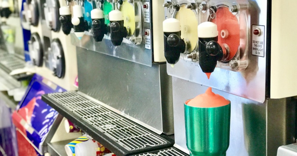 filling a tumbler with cherry Slurpee