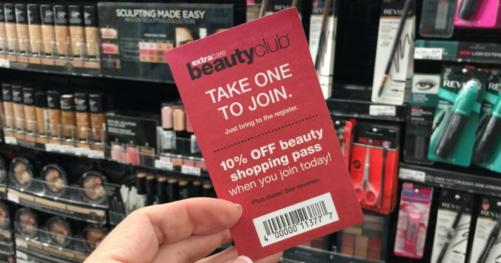 holding a CVS BeautyClub flyer