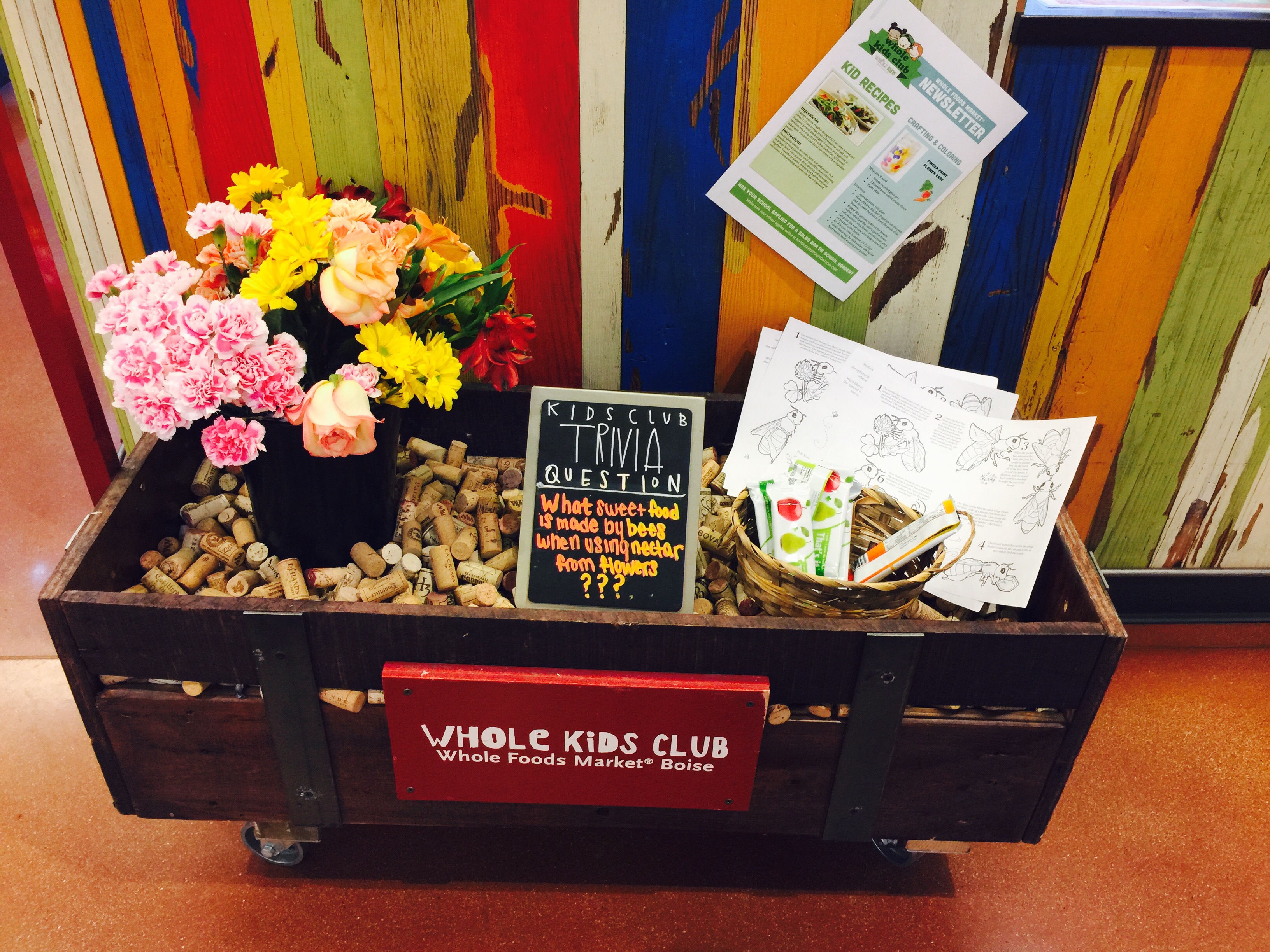 money-saving hacks at Whole Foods Market – kids' club in store display