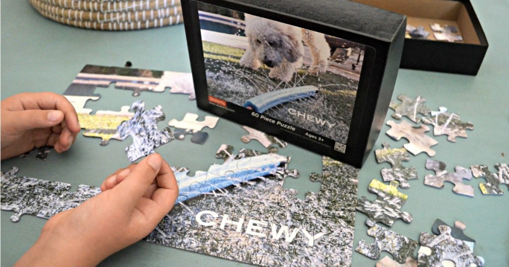 child putting together a dog puzzle