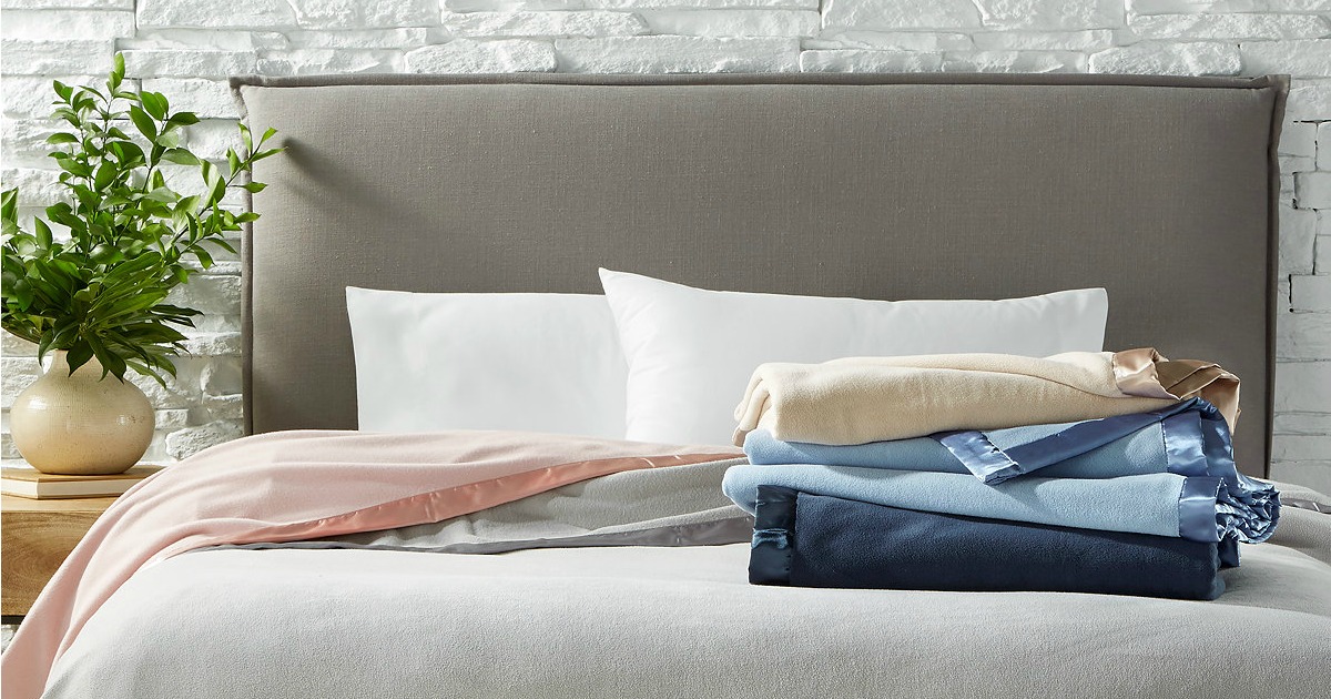 Martha Stewart Soft Fleece Blankets folded up on bed