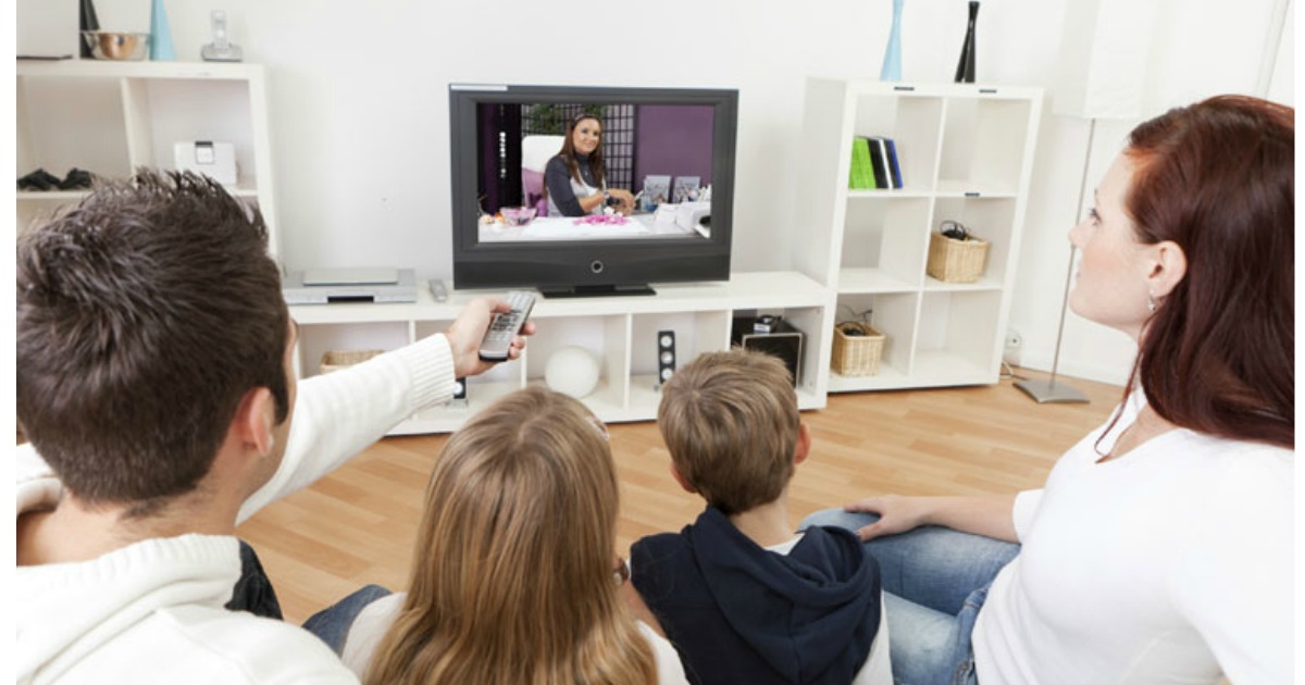 family watching tv in a living room