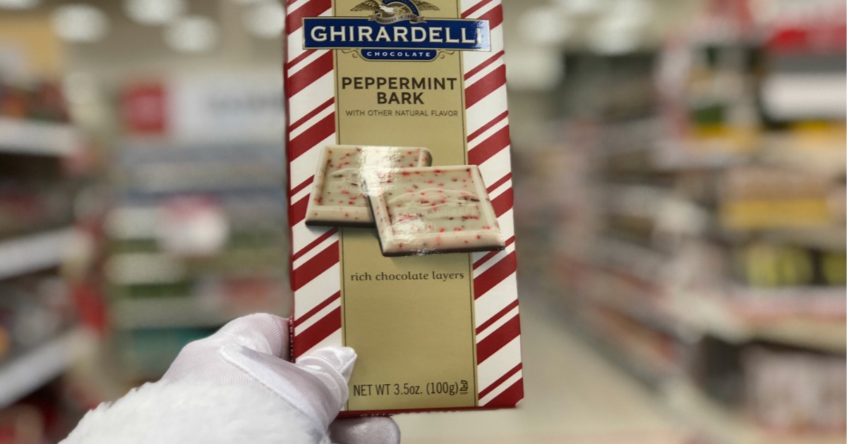 santa hand holding box of ghiradelli chocolates