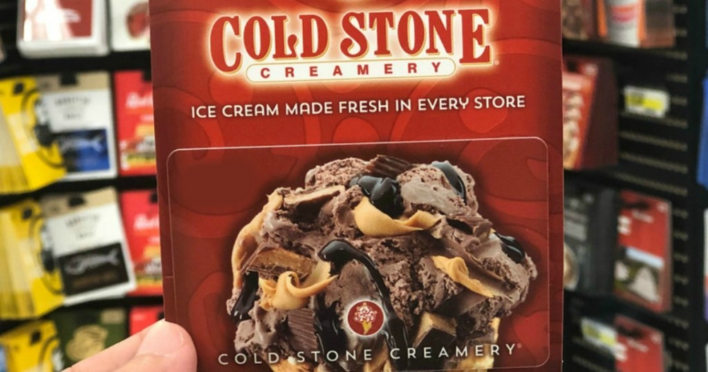 hand holding cold stone creamery gift card in store