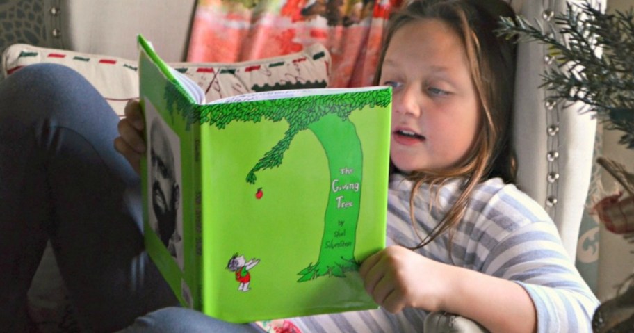 girl reading the giving tree book