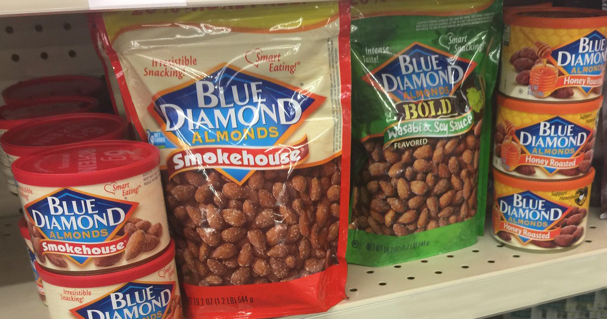 assorted blue diamond almond bags and cans on a store shelf